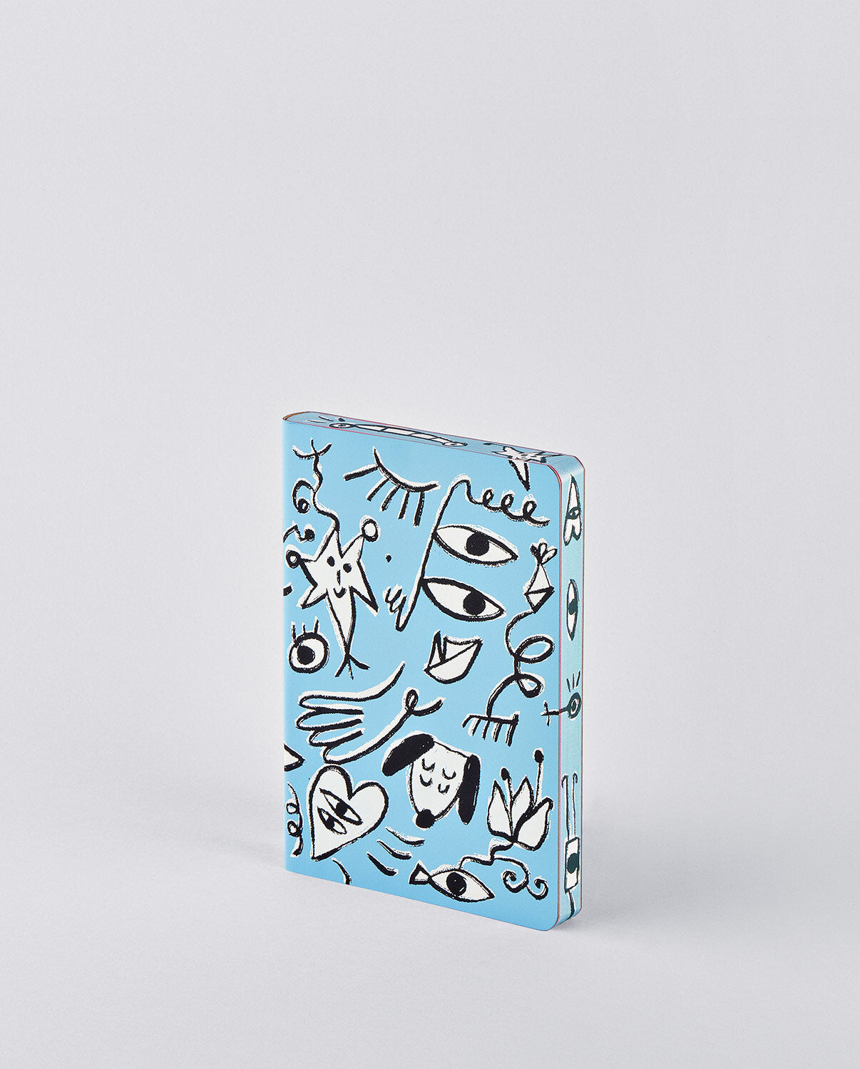 notatnik artystyczny Day Dreamer z niebieską okładką i abstrakcyjnymi czarno-białymi rysunkami