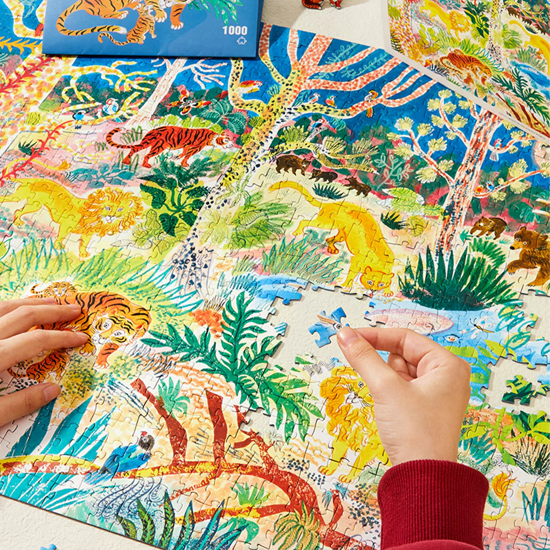 Puzzle artystyczne 1000 elementów marki mideer z kolorowym obrazem zwierząt w dżungli podczas układania