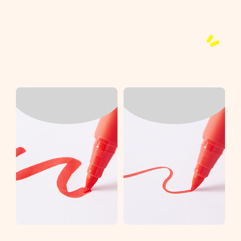 Czerwony marker akrylowy z pędzelkową końcówką rysujący linie na białej powierzchni