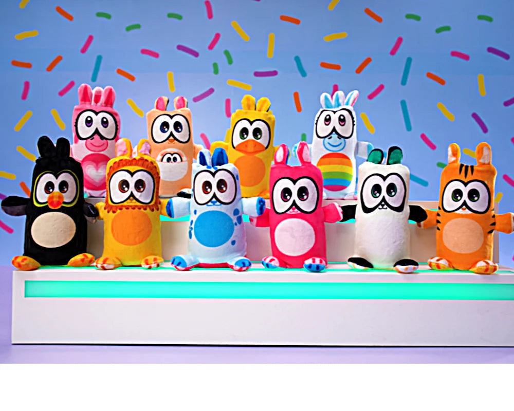 Zestaw kolorowych pluszowych zabawek maskotka Flipzers jednorożec od Yamann na jasnym tle