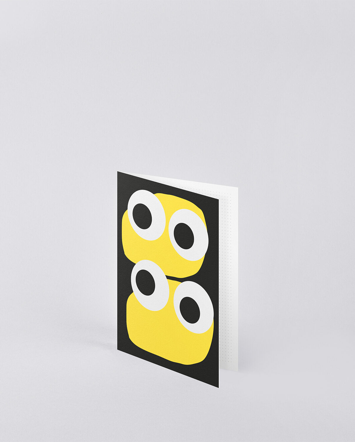 Kartka okolicznościowa Jim z żółtymi nadrukami oczu na czarnym tle od BV Jacob Company