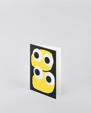Kartka okolicznościowa Jim z żółtymi nadrukami oczu na czarnym tle od BV Jacob Company