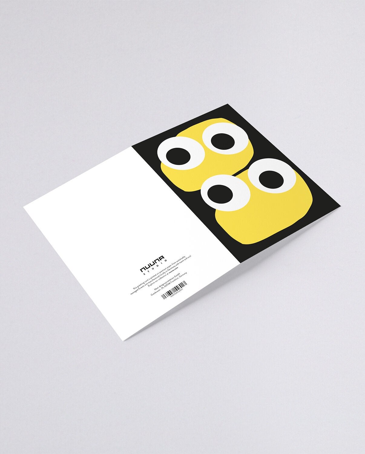 Kartka okolicznościowa Jim z dwoma żółtymi postaciami o dużych oczach na czarnym tle