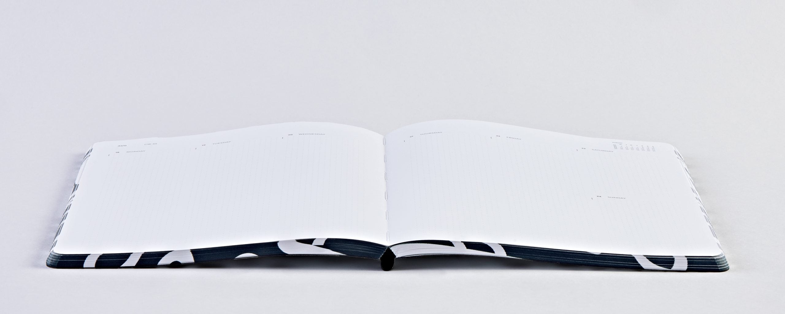 Otwarty kalendarz tygodniowy 2025 firmy BV JACOB COMPANY z pustymi stronami na planowanie