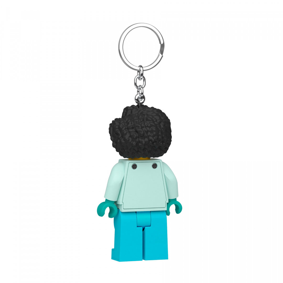 Brelok LEGO z latarką w kształcie figurki z niebieskimi spodniami i czarnymi włosami