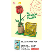 Drewniane puzzle 3D róża w czerwonym kolorze z zielonym pniem i ozdobnym żółtym pojemnikiem