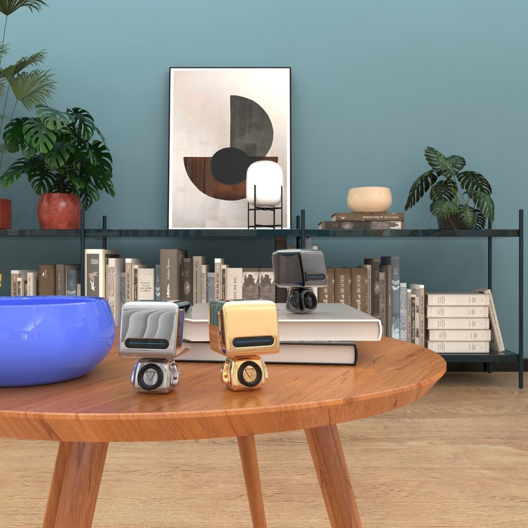 Głośnik bezprzewodowy Astro w kolorze srebrnym i złotym na drewnianym stole w nowoczesnym salonie