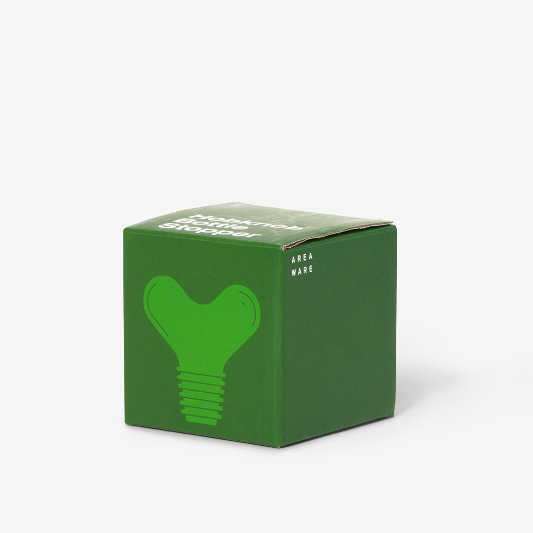 Opakowanie zielonego korka do butelek zielony design marki Areaware na białym tle