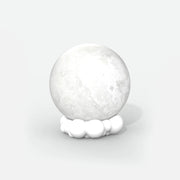 Lampka nocna z głośnikiem Yamann w kształcie księżyca na białej podstawie