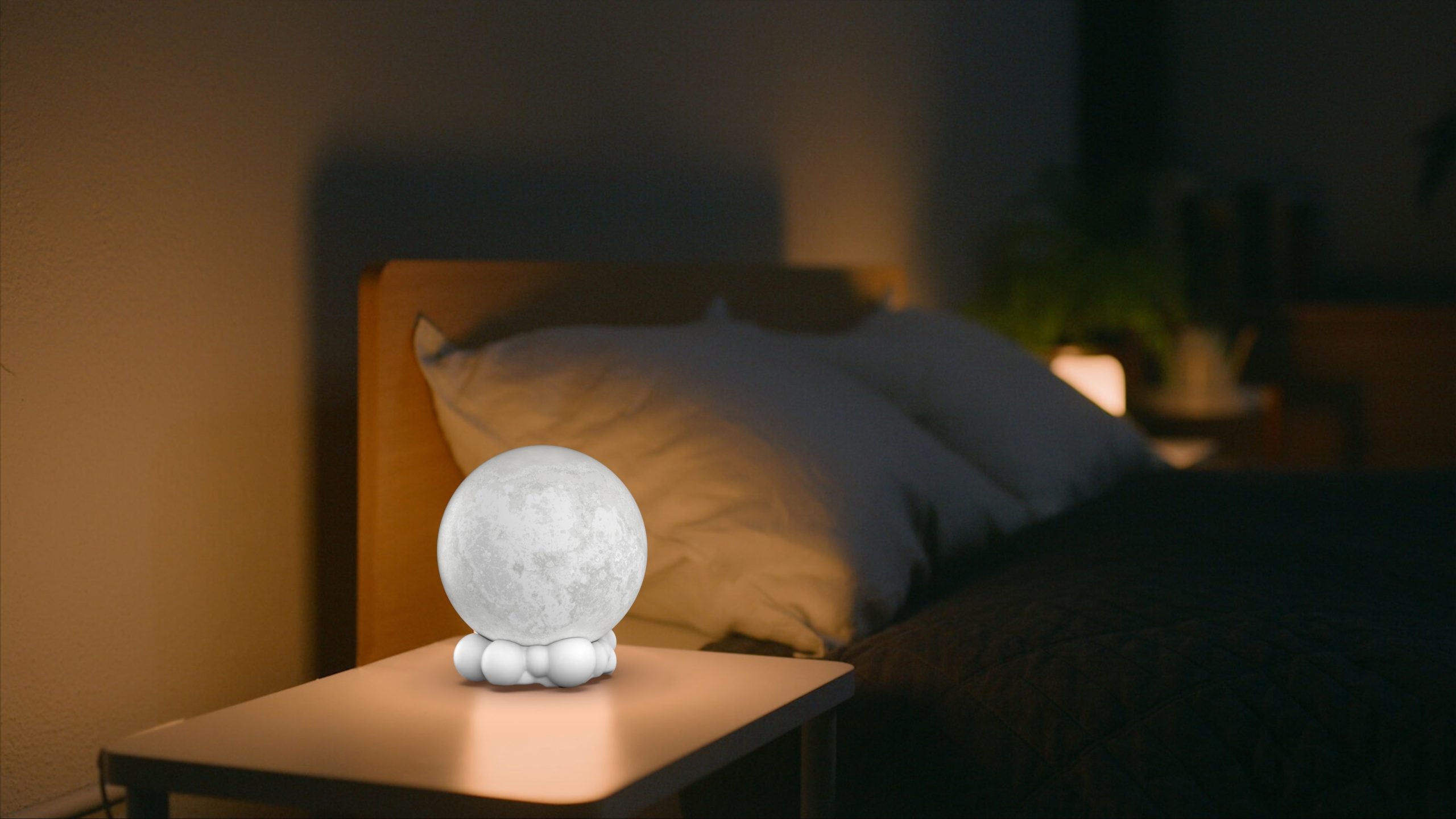 Lampka nocna z głośnikiem Yamann w kształcie księżyca na stoliku nocnym przy łóżku