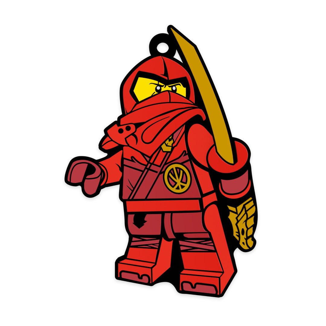 Magnes LEGO Ninjago Kai przedstawiający czerwoną figurkę ninja z mieczem