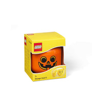 Pojemnik LEGO dynia w pomarańczowym kolorze z uśmiechniętą twarzą halloweenową w żółtym opakowaniu