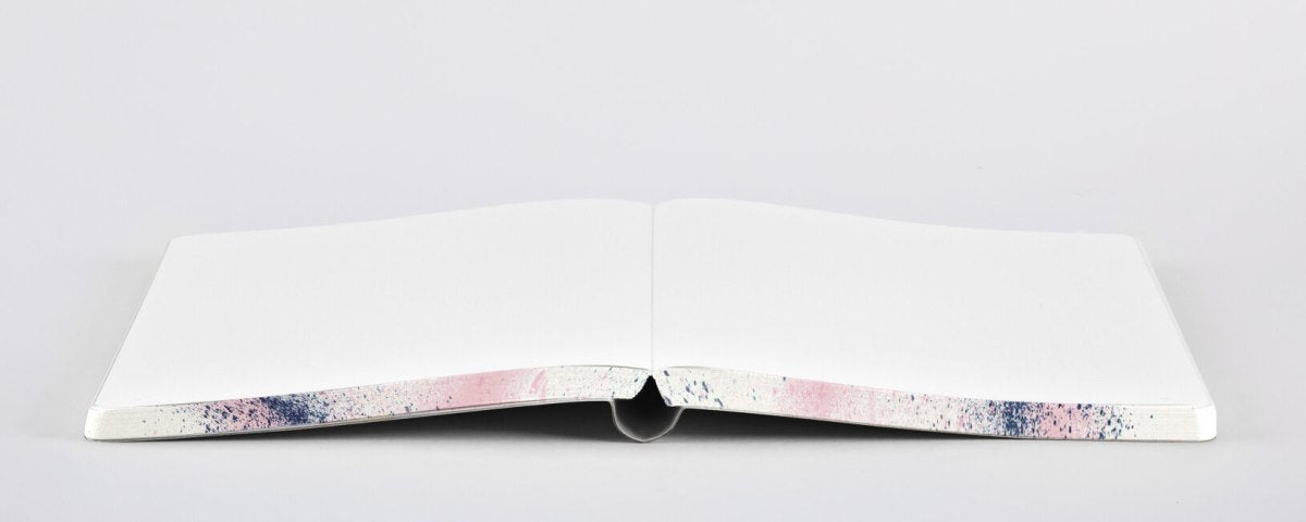 Otwarty notatnik artystyczny Splash z białymi kartkami i kolorowym wzorem na brzegach