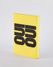 Żółty notatnik Oui Oui z dużym czarnym napisem na okładce firmy BV JACOB COMPANY