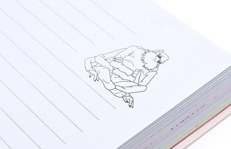 Linie na stronie notatnika Spirited Away z ilustracją postaci z filmu na białym tle