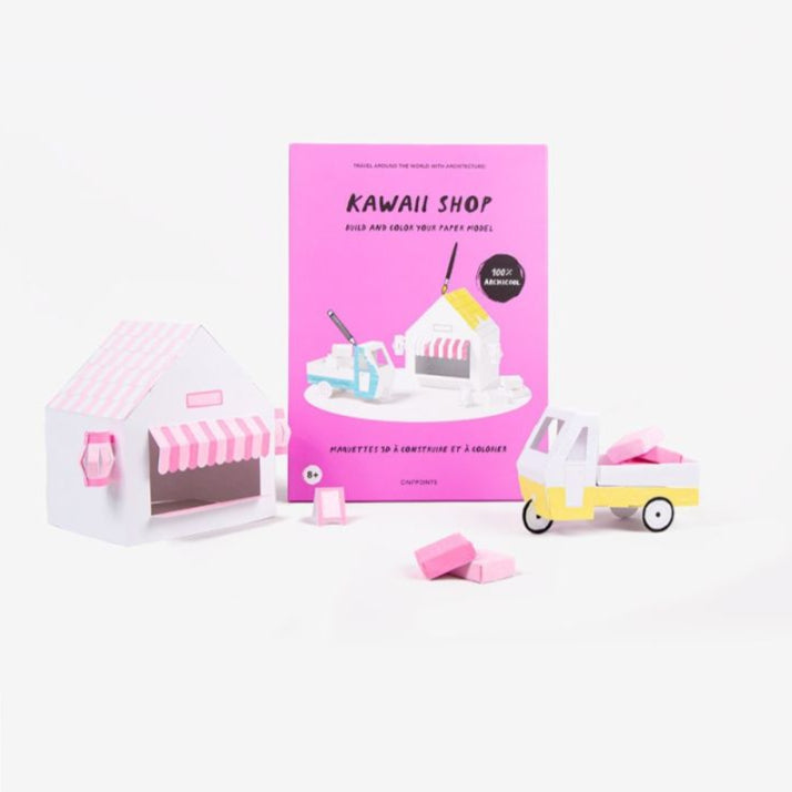 Papierowy model kawaii shop z różowym budynkiem sklepu i dostawczym rowerem marki Yamann
