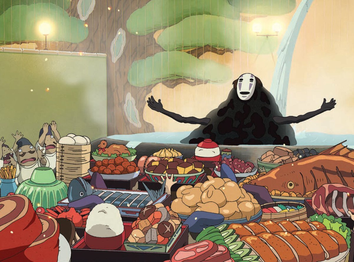 Pluszowy notatnik No Face inspirowany postacią z filmu Spirited Away w otoczeniu jedzenia