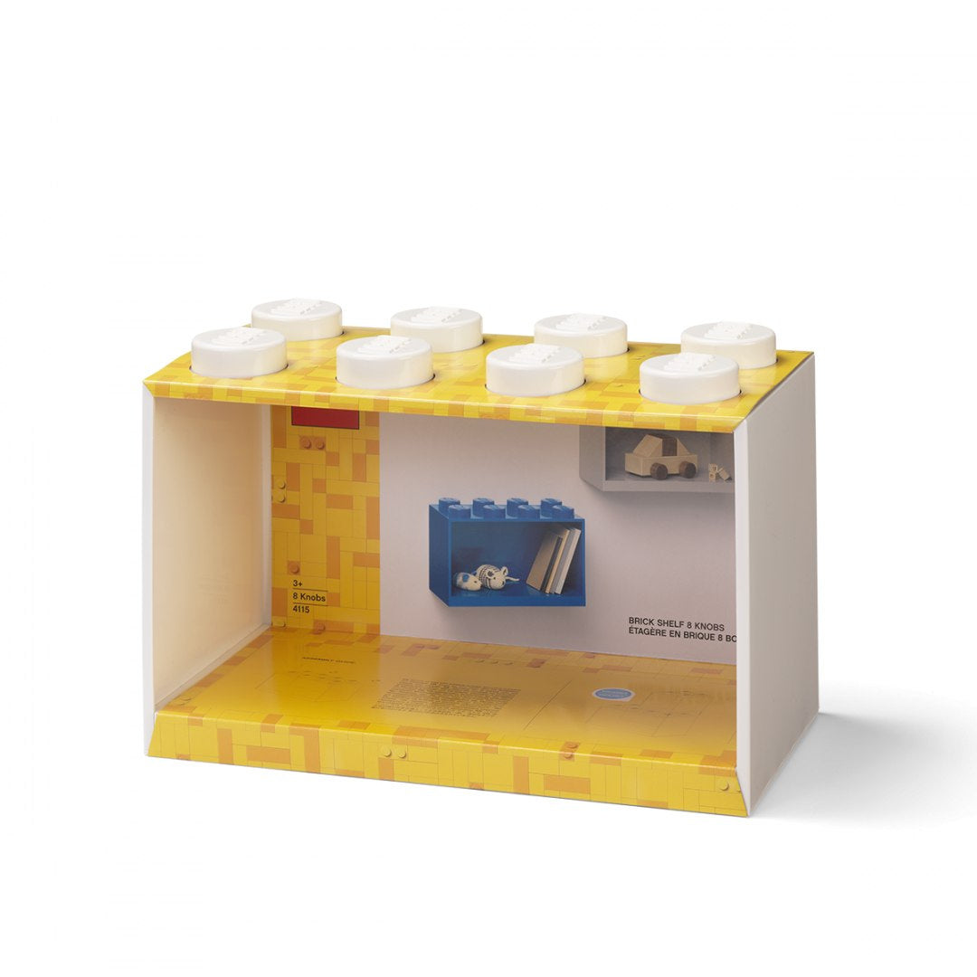 Biała półka LEGO w kształcie klocka z żółtym blatem na akcesoria i dekoracje