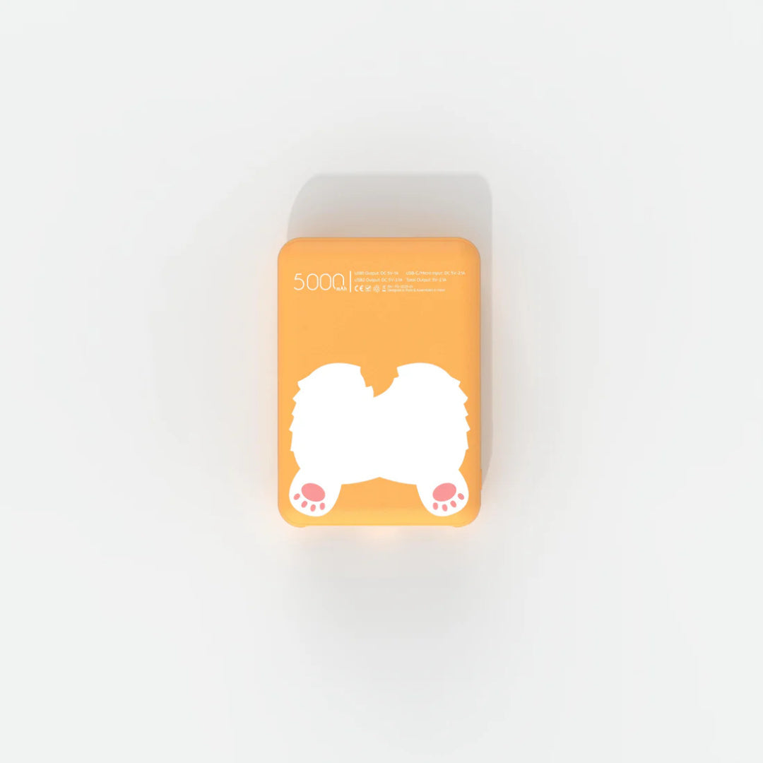 Powerbank piesek corgi Yamann w pomarańczowym kolorze z nadrukiem psich łapek i pojemnością 5000 mAh
