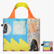 Kolorowa torba podręczna RUOHAN WANG od Yamann z abstrakcyjnym wzorem i pomarańczowo-żółtymi uchwytami