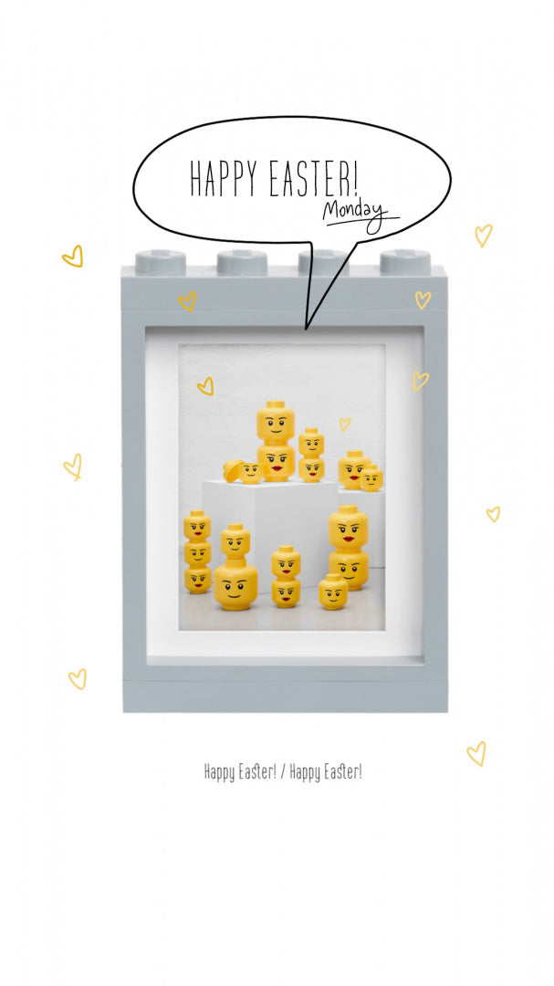 Szara ramka LEGO na zdjęcia z białym wnętrzem i żółtymi klockami LEGO o różnych wyrazach twarzy