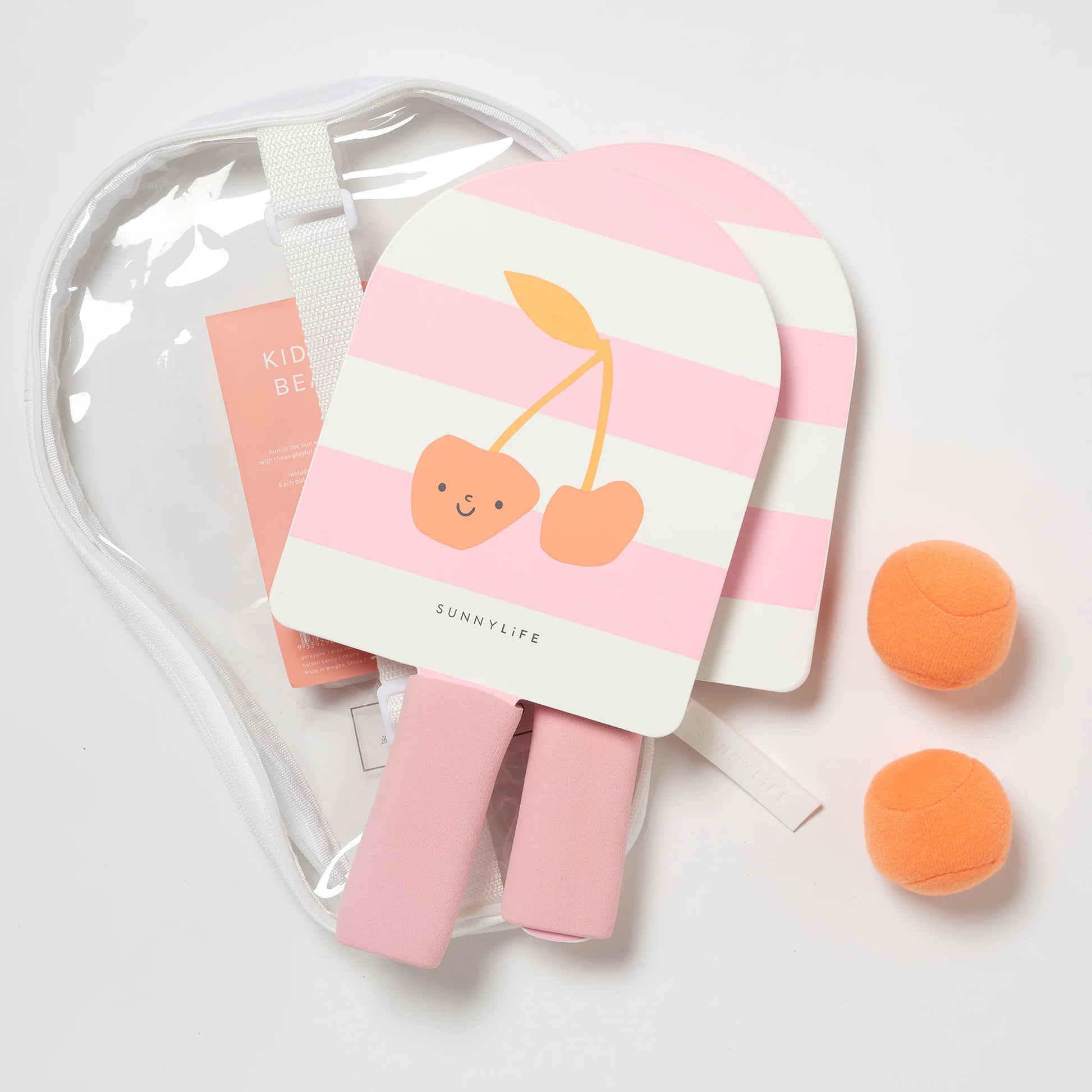 Kolorowe rakietki plażowe dla dzieci z motywem wiśni i piłkami w przezroczystym etui marki LOQI