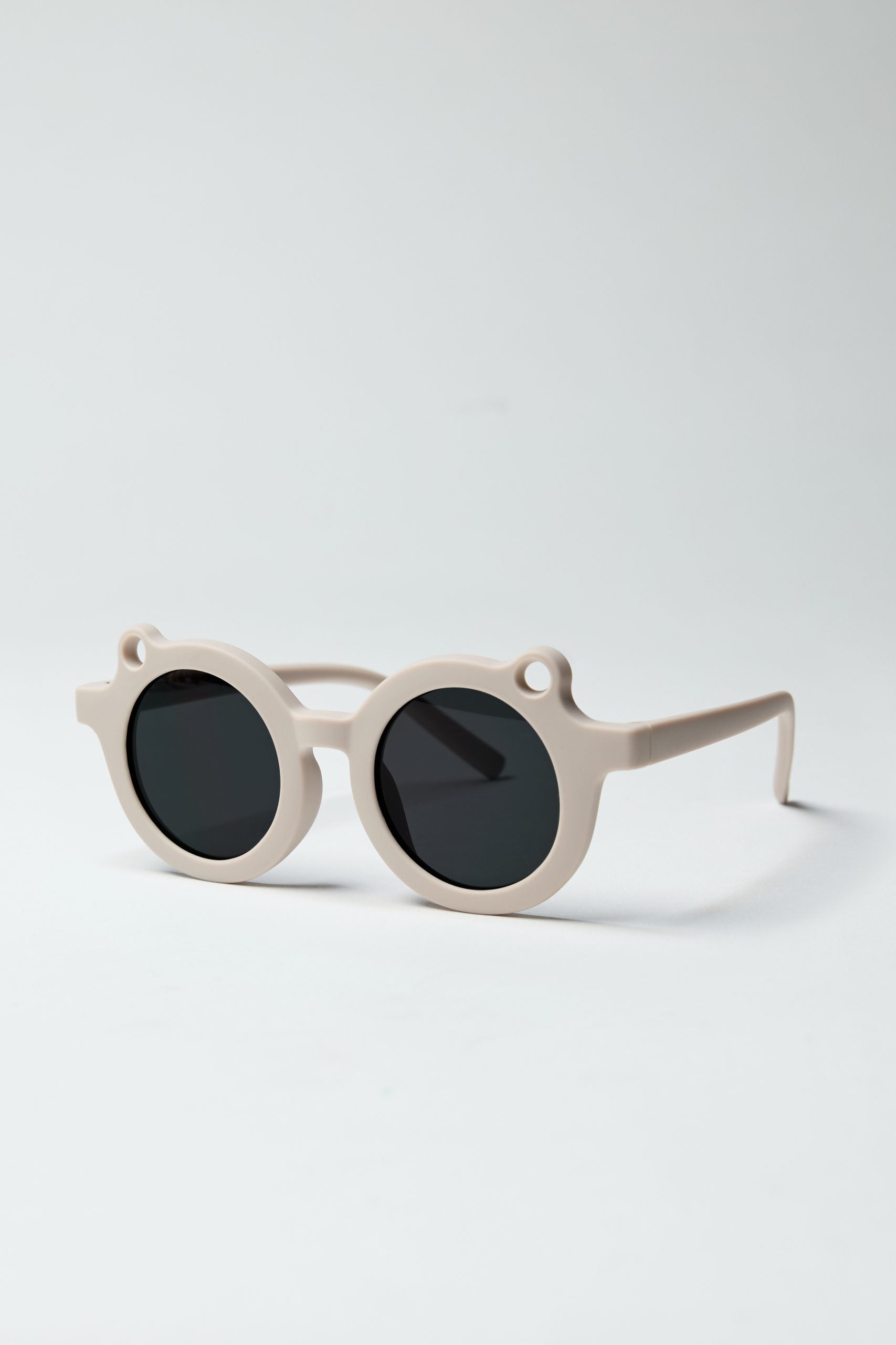 Beżowe okrągłe okulary przeciwsłoneczne dla dzieci marki BV JACOB COMPANY z ciemnymi soczewkami