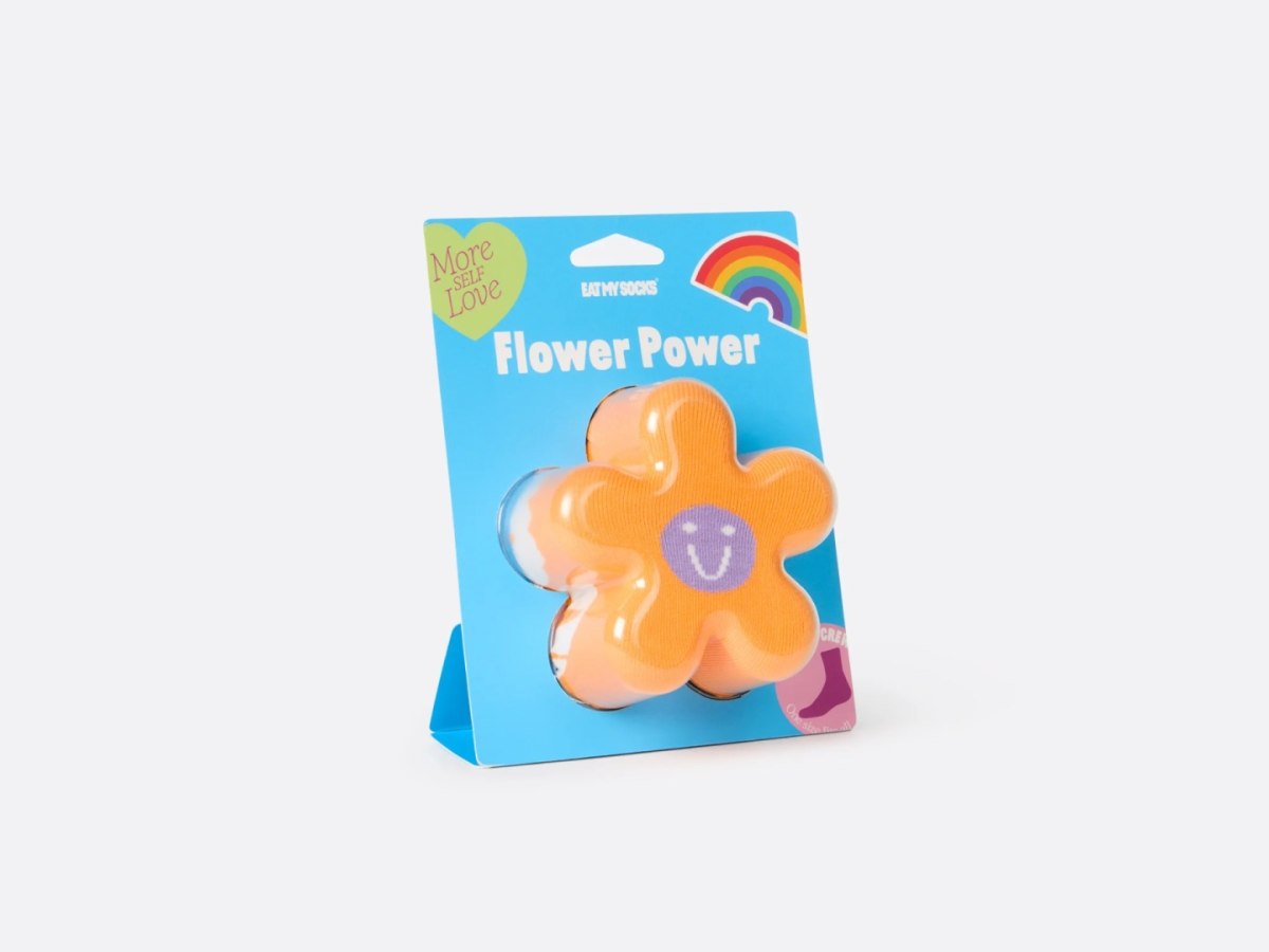 skarpetki ems flower power w kształcie pomarańczowego kwiata opakowane na niebieskim tle