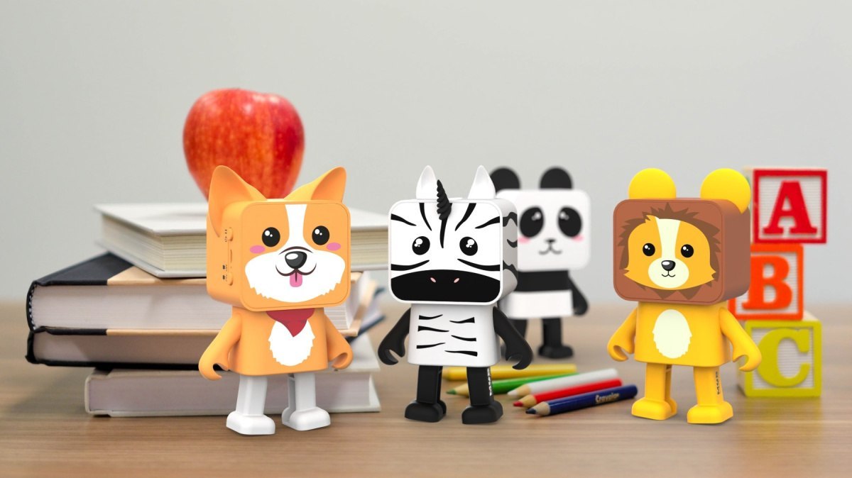 Głośnik bezprzewodowy corgi WABOBA AB w kształcie uroczego psa na biurku z książkami i zabawkami