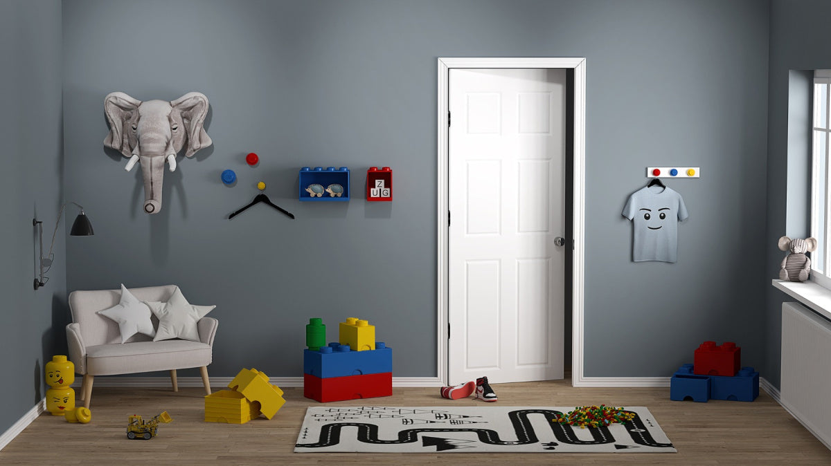 Wieszaki LEGO na ścianę w nowoczesnym pokoju dziecięcym z zabawkami i meblami