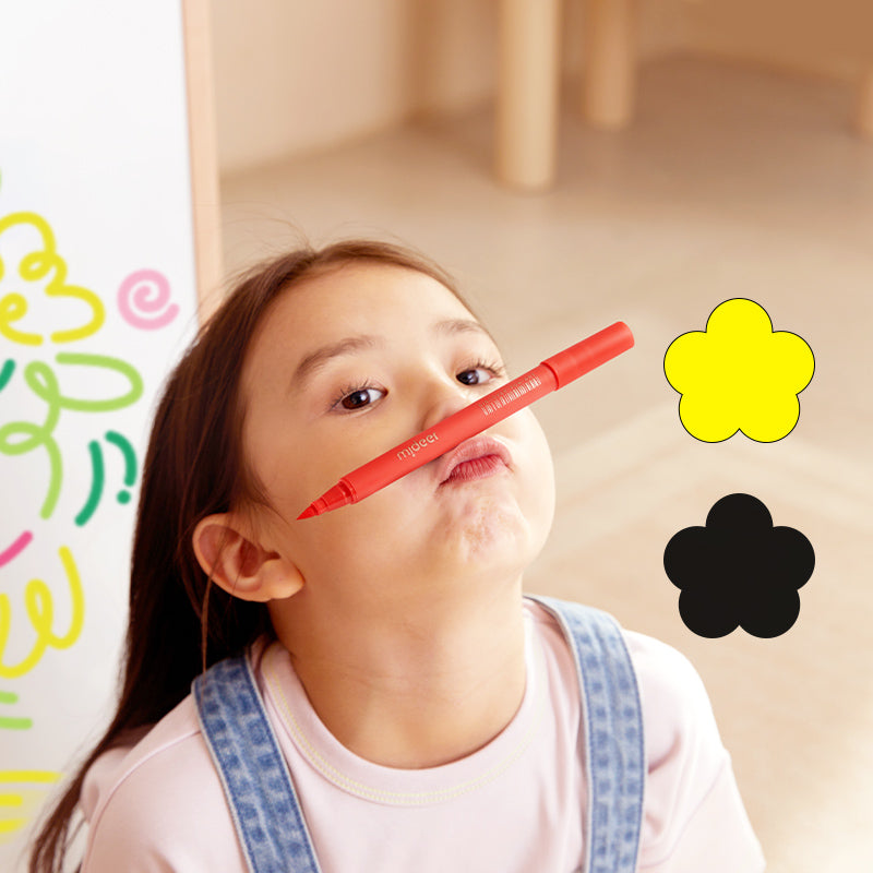 Markery akrylowe z pędzelkową końcówką czerwoną w użyciu uśmiechniętego dziecka