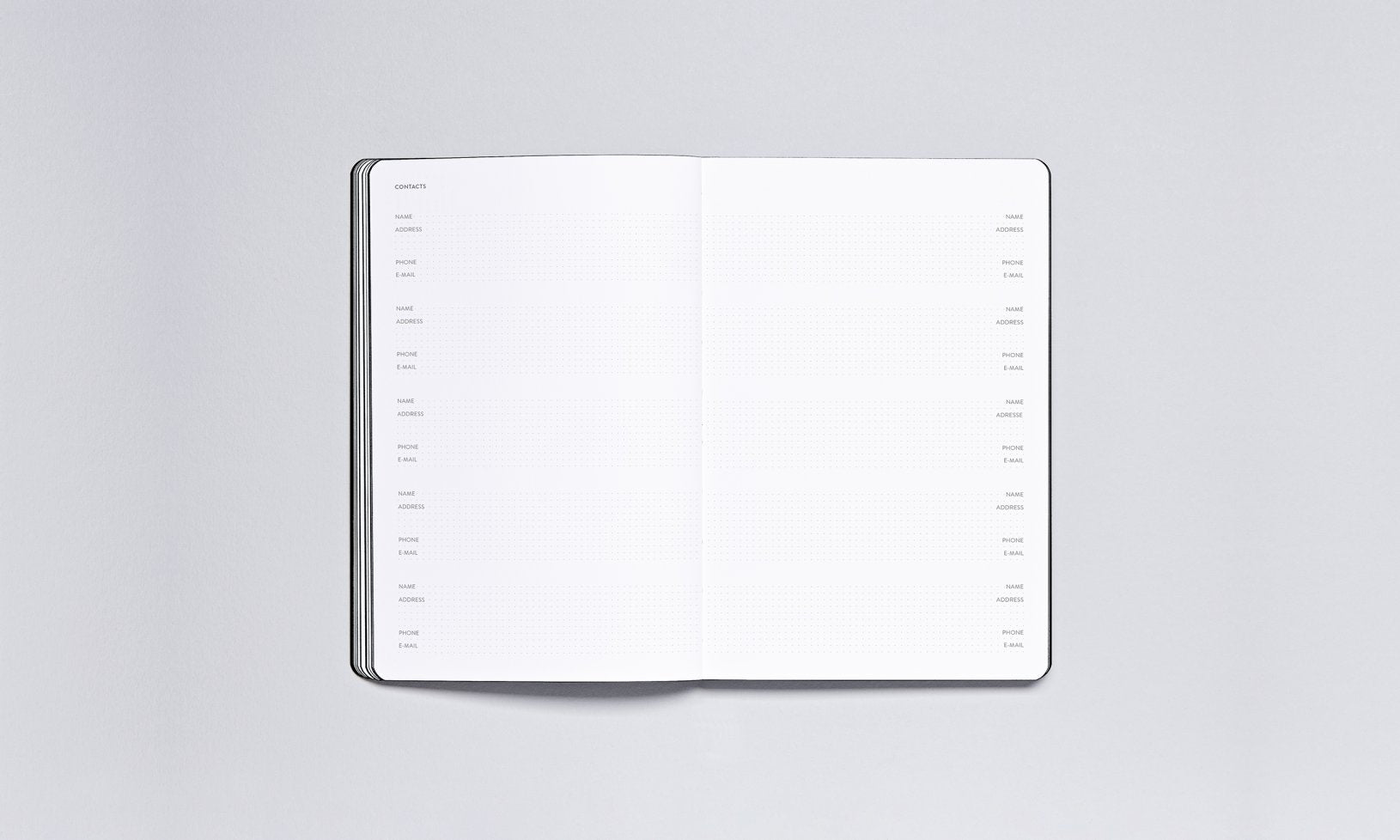 Otwarty notes z pustymi stronami do zapisywania planów w kalendarzu tygodniowym 2025