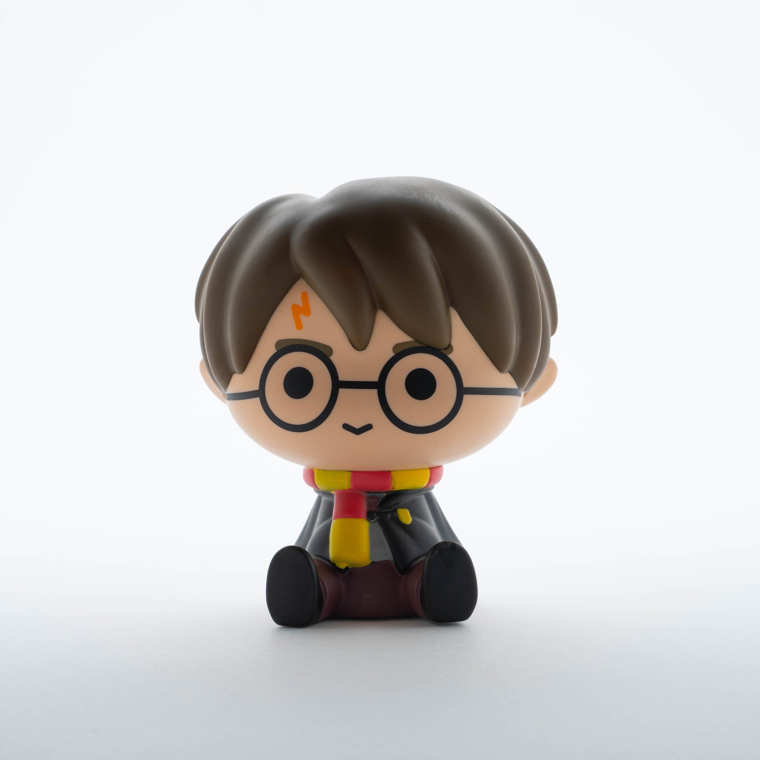 Skarbonka Harry Potter postać z okrągłymi okularami i szalikiem w kolorach Gryffindoru