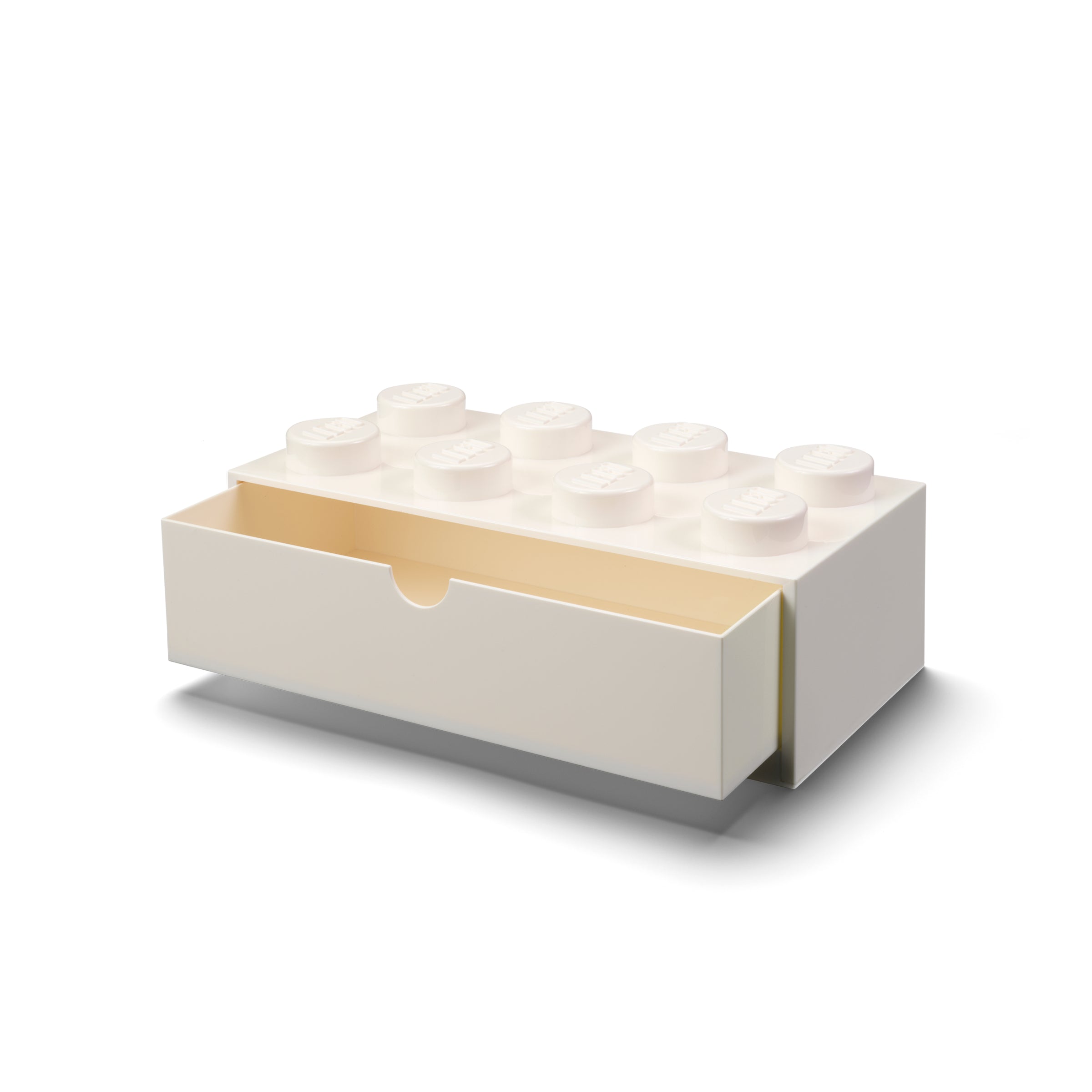 Biała szufladka LEGO na biurko w kształcie klocka z otwartą szufladą do przechowywania