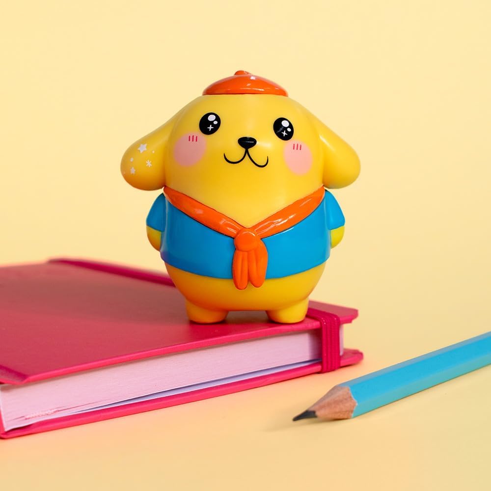 Yellow Hello Kitty Kawaii Style figure dressed in a blue shirt and a red scarf on a pink notebook.