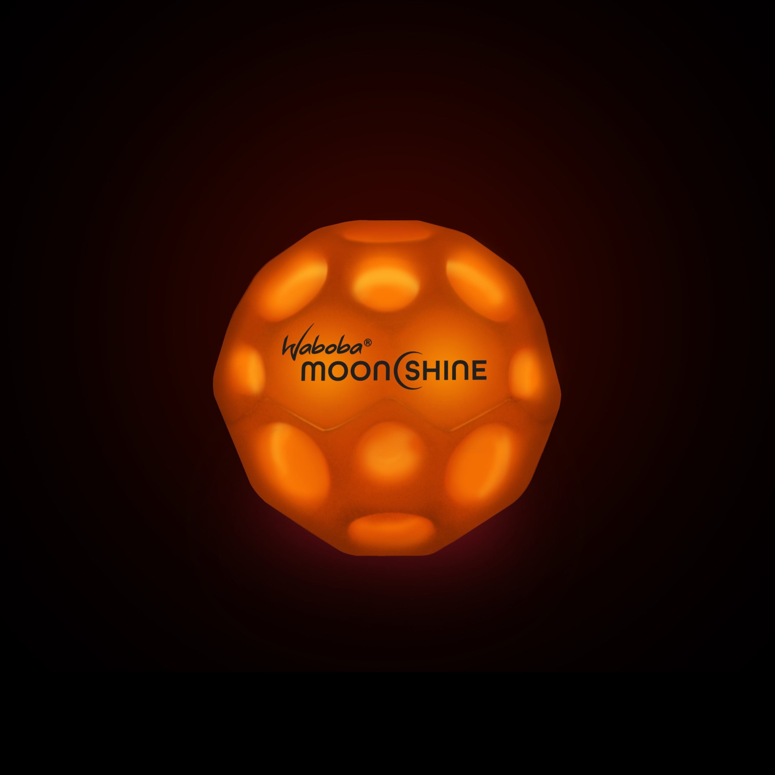 Pomarańczowa piłeczka świecąca Waboba Moonshine świecąca w ciemności z logo Waboba Moonshine