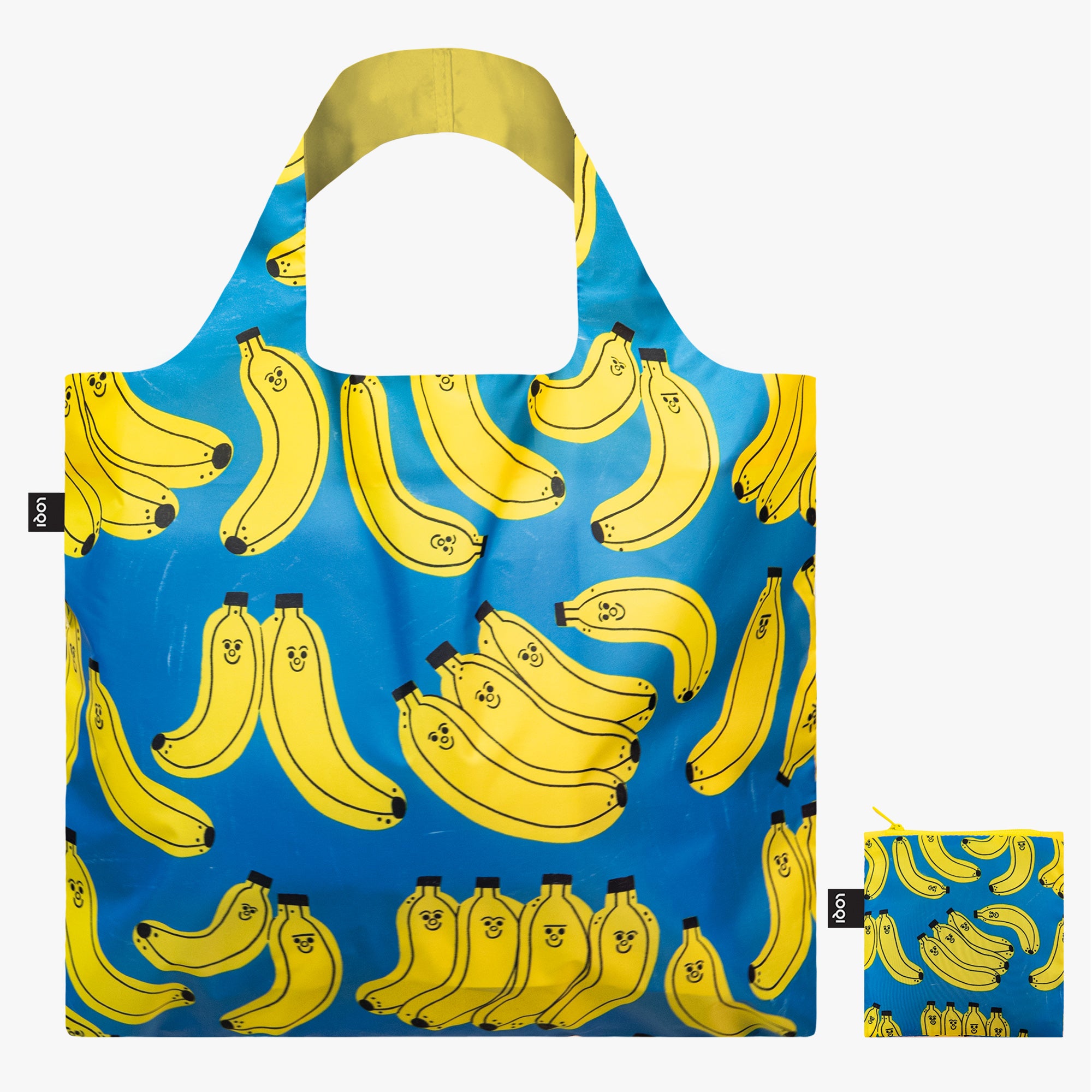 Torba podręczna z bananami na niebieskim tle z uśmiechniętymi żółtymi bananami od Yamann
