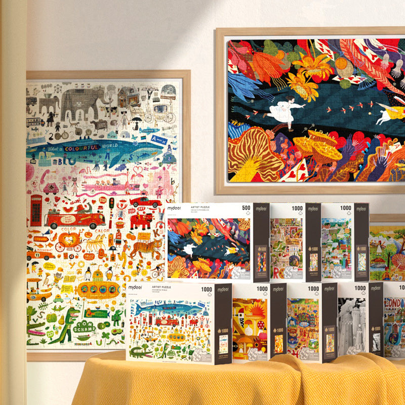 Puzzle artystyczne 500 elementów od mideer z kolorowymi ilustracjami na ścianie i opakowania na stole