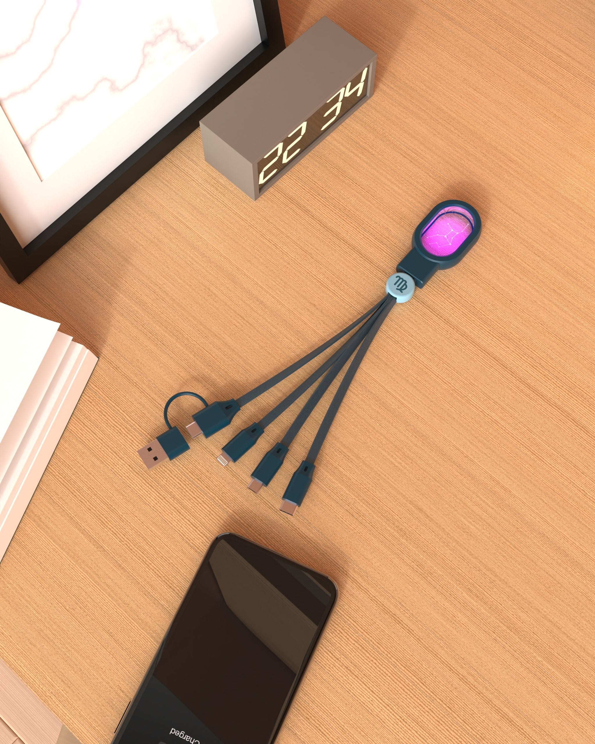 Kabel 5 w 1 zodiak strzelec od WABOBA AB leżący na drewnianym biurku obok telefonu i zegara
