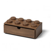 drewniana szufladka LEGO na biurko w kolorze brązowym z ośmioma wypustkami przypominającymi klocki LEGO