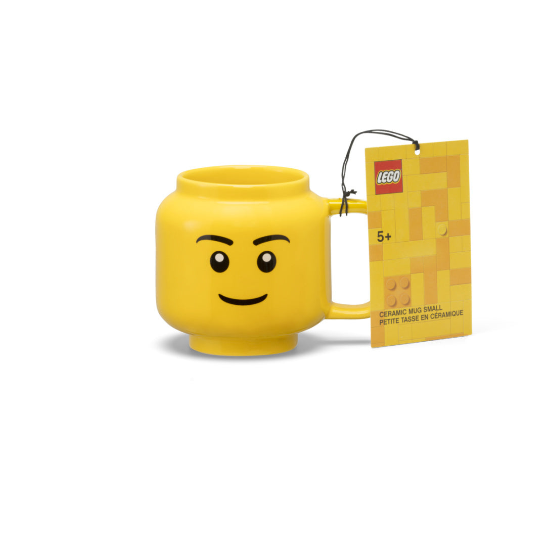 Żółty kubek LEGO ceramiczny chłopiec z uśmiechniętą twarzą i metką LEGO