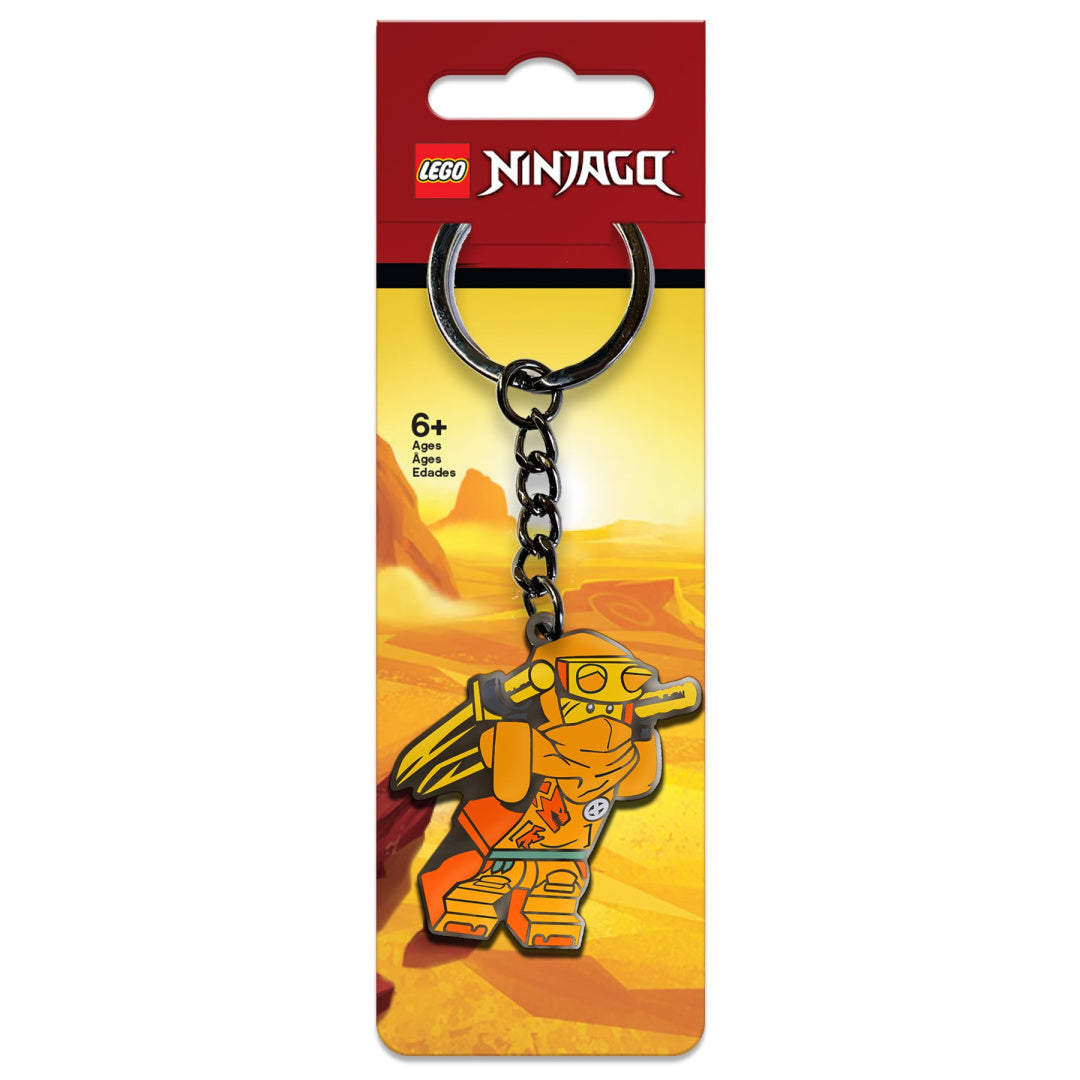 Brelok LEGO Ninjago Arin z postacią żółtego wojownika na tle pustynnym