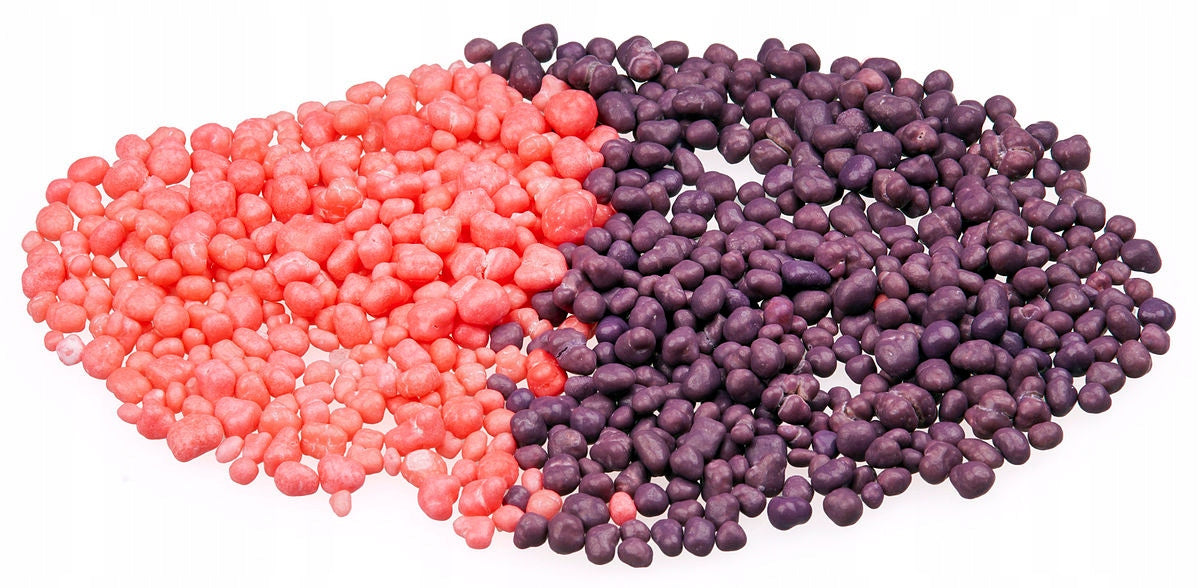 Colorful nerds grape strawberry candies in two flavors purple and pink