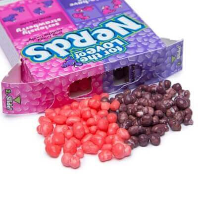 Nerds grape strawberry candies in a purple-pink Yamann package with scattered colorful balls