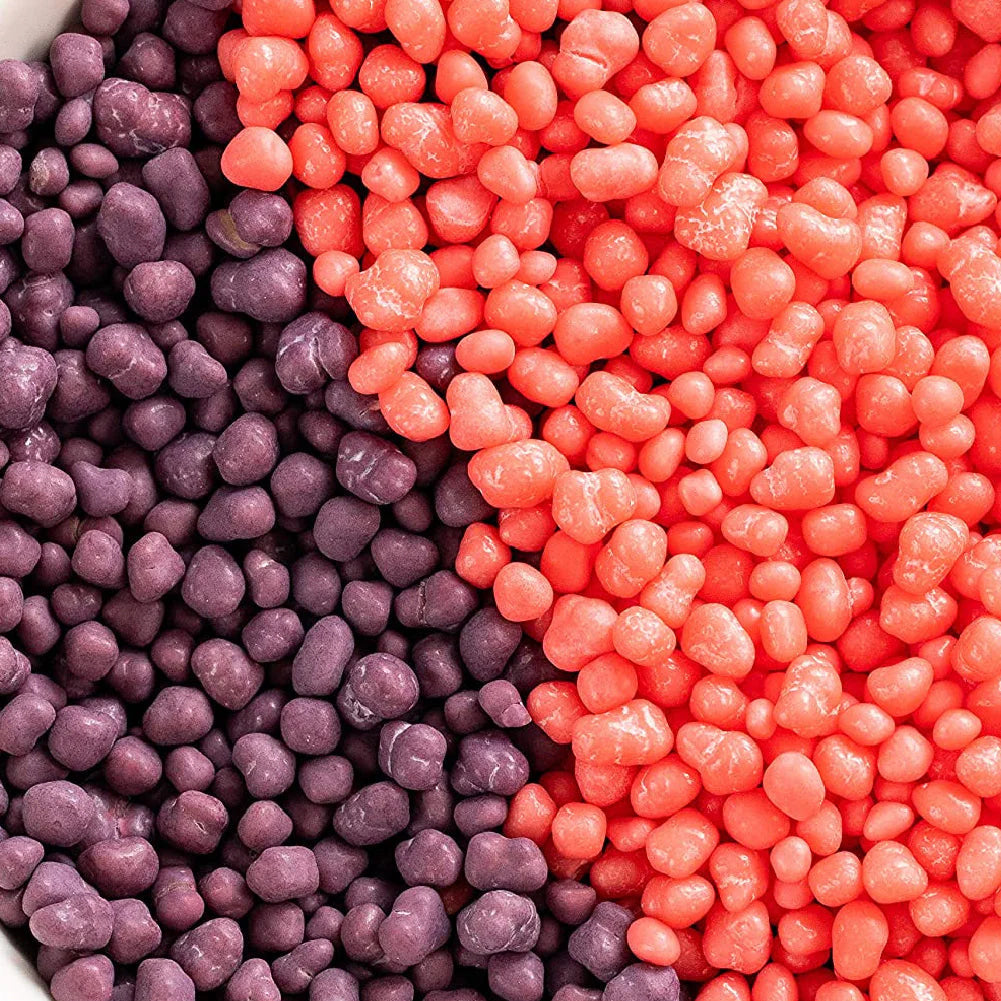 Colorful nerds grape strawberry candies in shades of purple and red, close-up