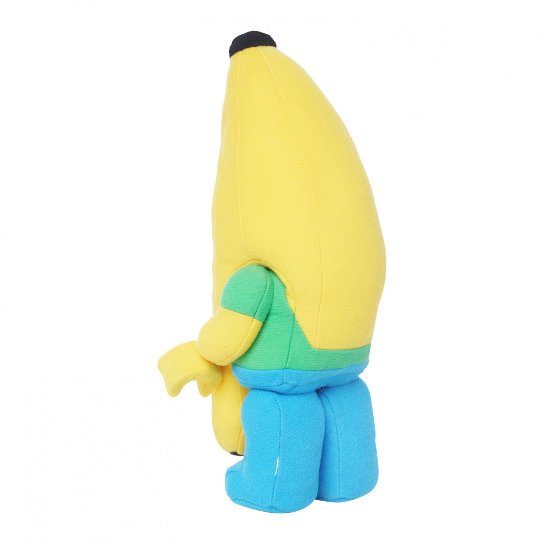 Pluszak LEGO banan w kształcie żółtego banana w niebieskich spodniach i zielonej koszulce