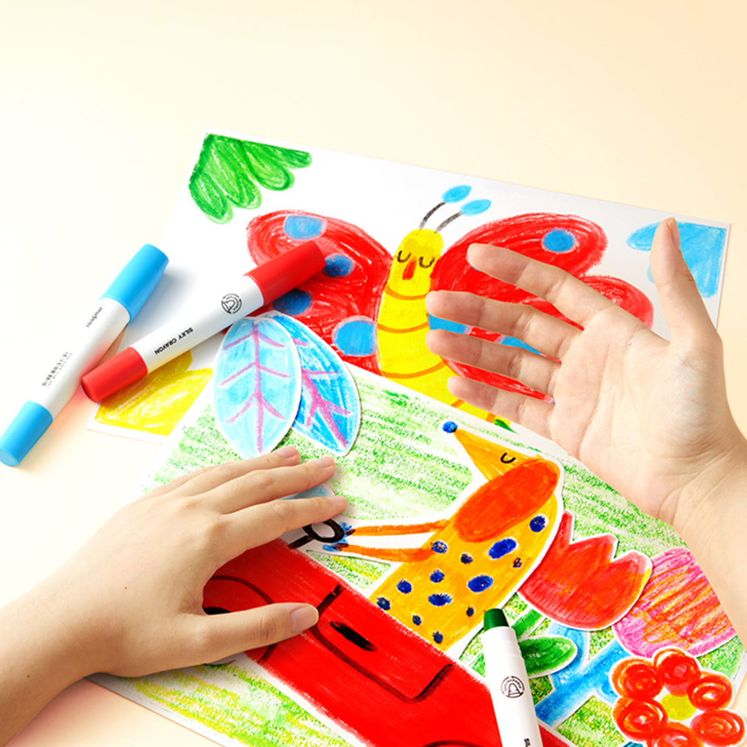 Dziecko rysujące kolorowymi kredkami silky crayons 36 kolorów na białych kartkach z motywem zwierząt